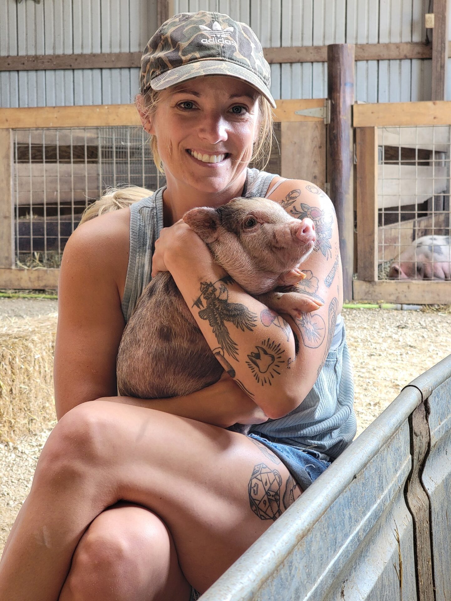 Lady Holding Piglet in Their Arm by a Shead